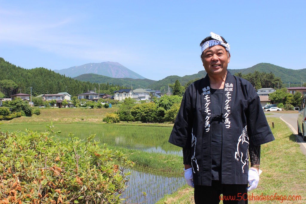Our Tour Guide in front of the Rice Fields at Takazawa